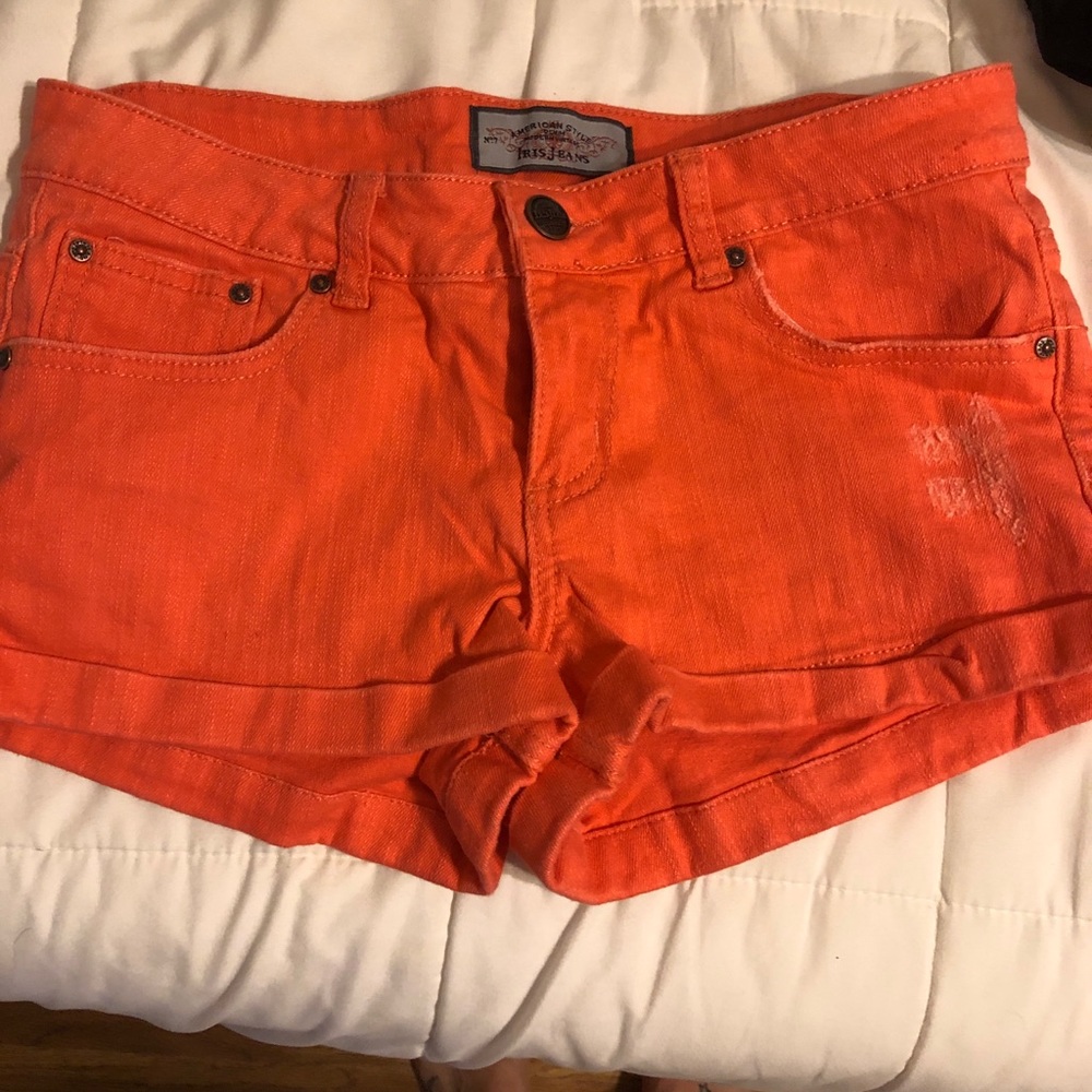 Pink/orange colored shorts